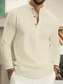 Close-up of beige waffle knit men's long-sleeved Henley shirt with chest pocket detail - S / Tops / Khaki