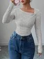 Detail of grey ribbed knit top with a stylish asymmetrical slanted neckline design. - S / Tops / Gray
