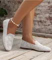 Close-up view of white knit round toe flat loafers featuring a breathable mesh texture - 35 / White