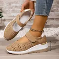 Detail view of breathable wedge sneaker with 5.5cm heel height and velcro strap. - 37 / Brown