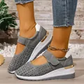 Detailed macro view of grey hollowed-out wedge sneakers featuring Velcro and gold accents - 37 / Gray