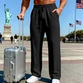 Detail view of men's black loose straight-leg sweatpants with a drawstring waist - S / Bottoms / Black