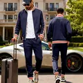 Full view of men's navy blue tracksuit set with sporty stripes in luxury lifestyle setting - S / Top And Bottom / Navy Blue