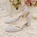 Close-up of silver glitter block heel sandals with pointed toe and ankle strap detail. - 34 / Ankle Strap Pointed Toe Style / Silver