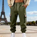 Detail view of men's fleece cargo sweatpants with striped pocket flaps and elastic cuffs - Army Green