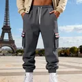 Detailed view of men's grey fleece cargo sweatpants with striped pocket accents in Paris - Dark Gray