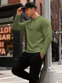 Close-up of men's olive green textured Henley shirt with waffle jacquard pattern - S / Tops / Army Green