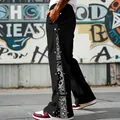 Detail of men's heavy hip hop pants with paisley bandana pattern and snap buttons. - S / Bottoms / Black