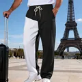 Dettaglio ravvicinato dei pantaloni uomo bicolore stile high street con coulisse in vita - Taglia S / Pantaloni e gonne / Nero