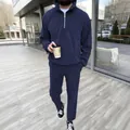 Full lifestyle view of the navy blue tracksuit set styled in an urban setting - S / Top And Bottom / Navy Blue