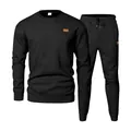 Detailed view of black men's crewneck jacquard knit tracksuit set with textured fabric - S / Top And Bottom / Black