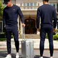 Men's navy blue two-piece sports casual set featuring textured jacquard knit design - Navy Blue