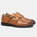Vista dettagliata di scarpe monk in pelle marrone con doppia fibbia e dettagli brogue. - 40 / Marrone