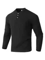 Macro detail of men's black waffle knit Henley shirt featuring buttons and chest pocket - S / Tops / Black