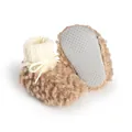 Close-up detail of winter plush baby booties with soft fleece lining and anti-slip dotted sole - 11cm / Coffee