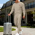 Stylish men's beige jacquard knitted tracksuit set shown in a luxury travel lifestyle scene - S / Top And Bottom / Khaki