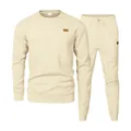 Macro view of the textured jacquard knit pattern on this men's cream casual sweatshirt set - S / Top And Bottom / Apricot