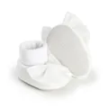 Detailed view of white baby socks featuring a large satin bow and anti-slip sole dots. - Insole Length 11cm / Bowknot Style (3314) / White