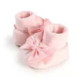 Close-up of soft pink baby floor shoes with large decorative satin bows and ribbed cuffs - 11cm / Pink