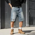 Men's loose fit light wash denim shorts with rhinestone embellishments and ripped details - S(28) / Bottoms / Blue