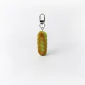 Gedetailleerde macroweergave van de creatieve simulatie gedraaide koekje sleutelhanger - 24x95mm