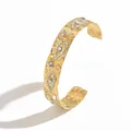 Close-up of a luxury gold-plated hammered stainless steel cuff bracelet with eye motifs - Triple Eyes Rhinestone Hammered Style (S3218C)