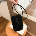 Black fuzzy crossbody phone bag with faux fur for a vintage autumn winter look - Black