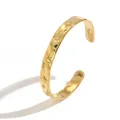 Detailed view of gold-plated stainless steel cuff bracelet with star engravings - Star Pattern Hammered Style (S3218K)