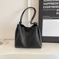 Minimalist black faux leather large capacity tote bag with stylish knot strap details - Black