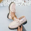 Fashionable pink platform loafers with lace-up detail in a classic British style. - 36 / Pink