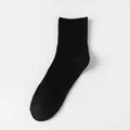 Classic men's black crew socks made of breathable pure cotton with ribbed cuffs. - Crew Socks / Black