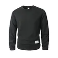 Detailed view of black crewneck sweatshirt featuring a unique textured diamond knit pattern - Black