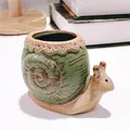 Side view of a vintage green snail-shaped ceramic succulent flower pot ornament - Small Snail / 9x5.5x7cm