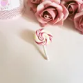Detailed view of a cute pink and white swirl lollipop brooch made of polymer clay. (81 chars) - Wine Red Lollipop Brooch