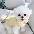Close-up of yellow quilted pet vest on a white dog showing fabric texture and design - L Back Length 39cm / Yellow Cotton Vest