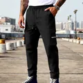 Detalle de pantalones cargo negros para hombre con bolsillo con cremallera y cordón. - S / Parte Inferior (CW-35) / Negro