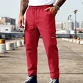 Vista detallada de pantalones cargo rojos para hombre con cordón y bolsillos con cremallera - S / Parte Inferior (CW-35) / Rojo