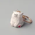 Detailed macro view of a hand-carved white wooden bear keychain with unique faceted texture - Wood Carved White Bear Keychain-Lobster Clasp / White