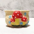 Close-up of a hand-painted ceramic succulent pot with cute red mushroom patterns. - Red Triple Mushroom Style (W)