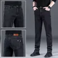 Vista dettagliata dei jeans da uomo slim fit dritti elasticizzati in colore grigio scuro - 28 / Pantaloni e gonne / Nero