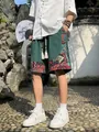 Casual men's ethnic style green linen shorts featuring intricate patterned hem embroidery - S / Bottoms / Green