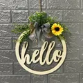 Detail view of rustic wooden hello door wreath with sunflower and greenery decoration - Hollow Hello No Light
