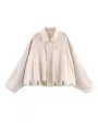 Vue détaillée d'un blouson aviateur court beige en suédine à manches larges - Blanc Cassé