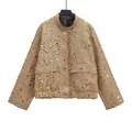 Detailed view of a golden tweed jacket with shimmering round sequins and pockets - XS / Tops / Original Gold