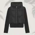 Close-up of women's black hybrid hooded padded jacket with slim fit quilted design - XS / Tops / Black