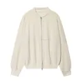 Detailed view of a cream oversized zip-up sweatshirt jacket with minimalist design - S / Tops / White