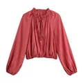 Front view of wrinkled terracotta long-sleeved cropped blouse with ruffled neck and tie - XS / Tops / Pink