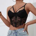 Close-up of a black lace corset camisole featuring sexy criss-cross chest straps. - S / Tops / Black