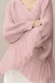 Detail showing the layered tulle ruffles and knit texture of a pink long sleeve sweater - Pink