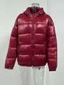 Detail view of the glossy red hooded puffer jacket featuring premium warm padding - S / Tops / Dark Red